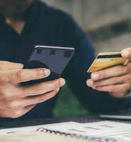 Man Holding Phone and Credit Card